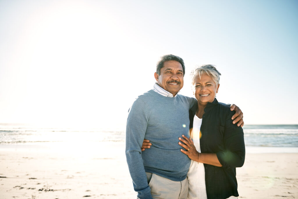 Cropped portrait of an affectionate senior couple on the beach during the summer time